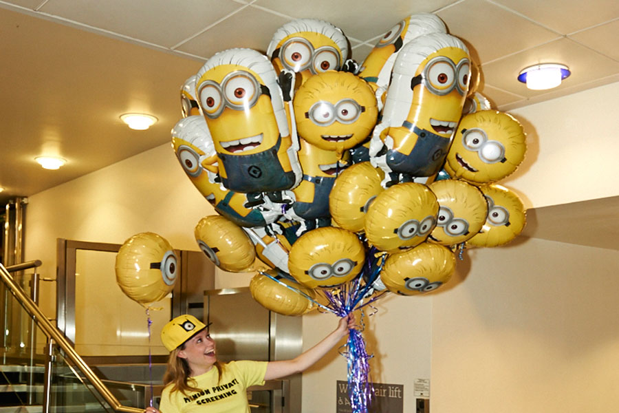 Themed balloon display welcoming guests to a corporate film screening with bespoke event entertainment and cinema décor.