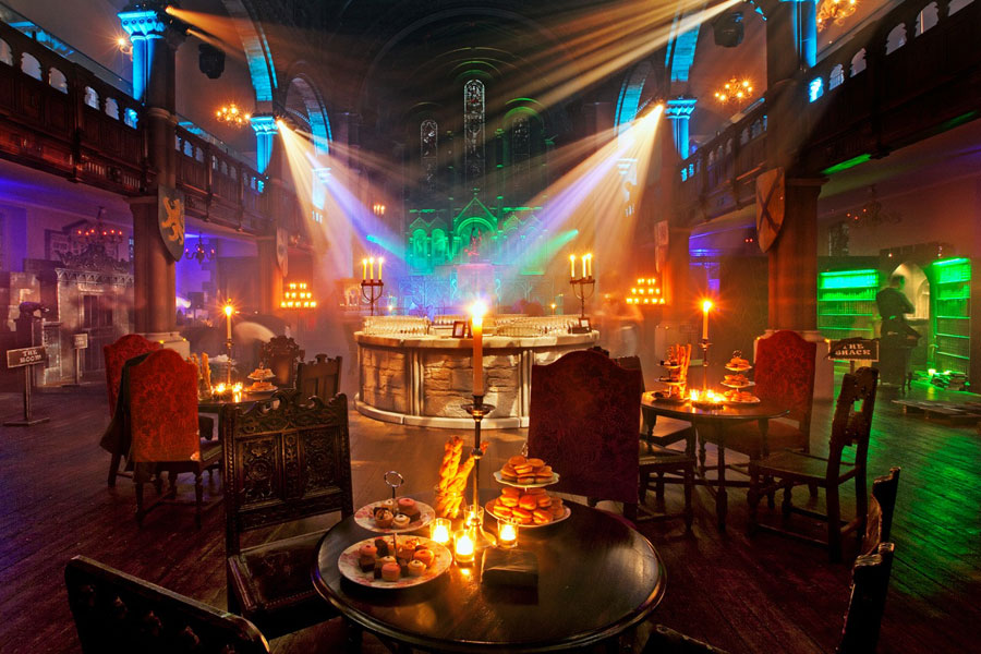 Immersive themed venue set for a corporate film screening event with bespoke décor, atmospheric lighting and luxury seating.